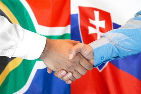 Business handshake on the background of two flags. Men handshake on the background of the South Africa and Slovakia flag. Support conceptの写真素材
