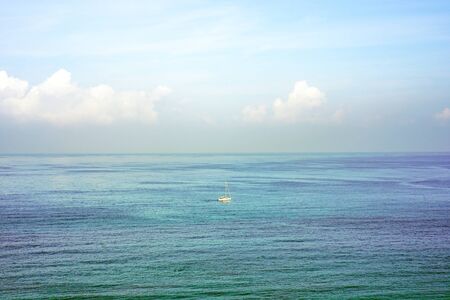  Yacht on the sea horizon on a summer day                              の写真素材