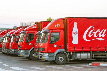 A row of Coca Cola truck in the parking lot. 3 October 2019 Rishon Litsion. Israel.