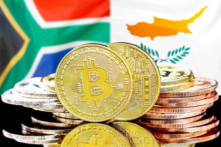 Concept for investors in cryptocurrency and Blockchain technology in the South Africa and Cyprus. Bitcoins on the background of the flag South Africa and Cyprus.の写真素材