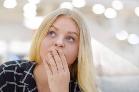 Portrait of a young blonde woman depression or domestic violence. People, grief and domestic violence concept. Coseup of unhappy crying girl.の写真素材