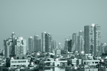 Modern city Tel Aviv with wireless network connection concept. Communication network concept 5G smart city on green background. Green tone city scape and network connection concept.のeditorial素材