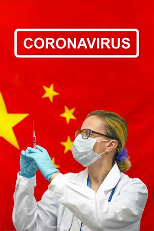 Female doctor or nurse in blue gloves holding syringe for vaccination. Medicine concept and fight the virus.の写真素材