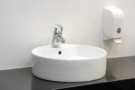 Bathroom interior sink with modern design. Interior of bathroom with washbasin and faucet.