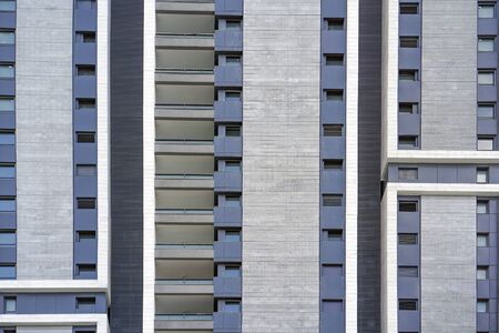 Abstract architecture. Modern apartment buildings in new neighborhood. Windows and balcony of a...