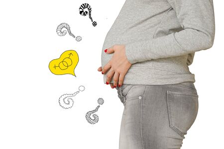 Question marks. Torso and hand of young pregnant wonan and question marks and symbol of man and woman isolated on the white background. Future mom expecting baby. Maternity concept.の写真素材