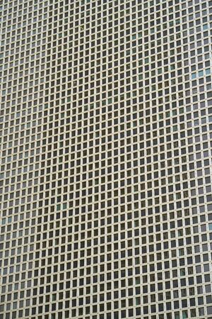 Glass grey square windows of facade modern city business building skyscraper. Modern apartment...