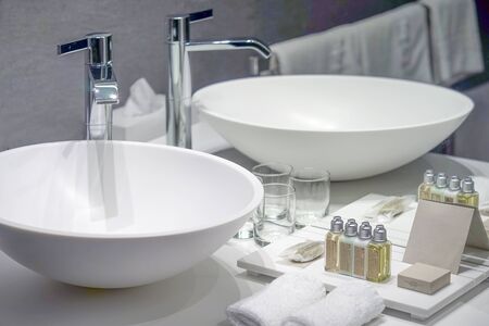 Interior of bathroom with washbasin and faucet. Bathroom interior sink with modern design in luxury hotel.の写真素材