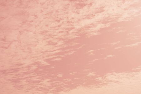 Pink sky with clouds background. Sky with pastel color gradient and grunge texture, nature abstract...