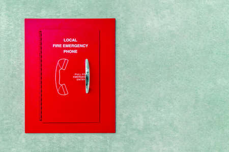 Red box of fire emergency phone. Red box emergency phone on the wall. Telephone Fire Alarm.の写真素材