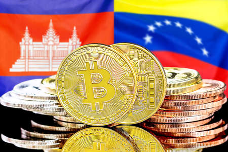 Concept for investors in cryptocurrency and Blockchain technology in the Cambodia and Venezuela. Bitcoins on the background of the flag Cambodia and Venezuela.の写真素材