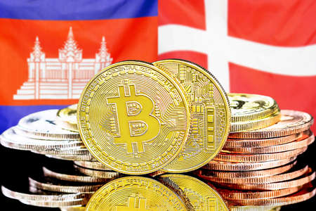 Concept for investors in cryptocurrency and Blockchain technology in the Cambodia and Denmark. Bitcoins on the background of the flag Cambodia and Denmark.の写真素材