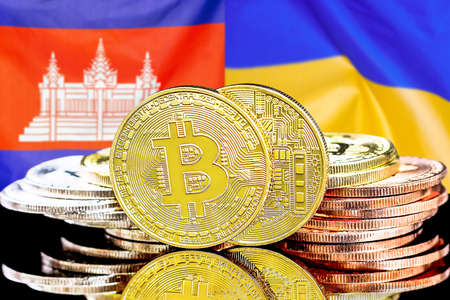 Concept for investors in cryptocurrency and Blockchain technology in the Cambodia and Ukraine. Bitcoins on the background of the flag Cambodia and Ukraine.の写真素材