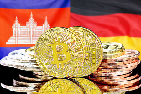 Concept for investors in cryptocurrency and Blockchain technology in the Cambodia and Germany. Bitcoins on the background of the flag Cambodia and Germany.の写真素材