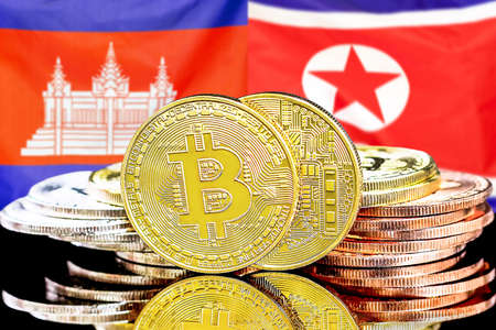 Concept for investors in cryptocurrency and Blockchain technology in the Cambodia and North Korea. Bitcoins on the background of the flag Cambodia and North Korea.の写真素材