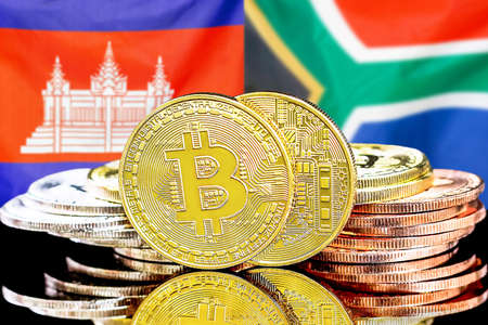Concept for investors in cryptocurrency and Blockchain technology in the Cambodia and South Africa. Bitcoins on the background of the flag Cambodia and South Africa.の写真素材