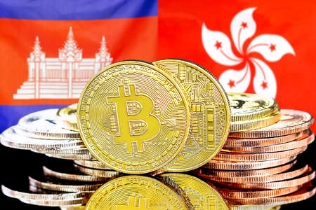 Concept for investors in cryptocurrency and Blockchain technology in the Cambodia and Hong Kong. Bitcoins on the background of the flag Cambodia and Hong Kong.の写真素材