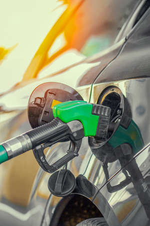 Close-up of gas pump fill at a gas station car.