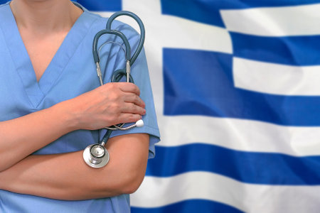 Female surgeon or doctor with stethoscope in hand on the background of the Greece flag. Surgery concept in Greeceの写真素材