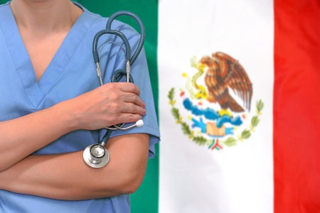 Female surgeon or doctor with stethoscope in hand on the background of the Mexico flag. Surgery concept in Mexicoの写真素材