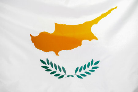 Fabric texture flag of Cyprus. Flag of Cyprus waving in the wind. Cyprus flag is depicted on a sports cloth fabric with many folds. Sport team bannerの写真素材