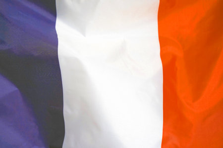 Fabric texture flag of France. Flag of France waving in the wind. France flag is depicted on a sports cloth fabric with many folds. Sport team bannerの写真素材