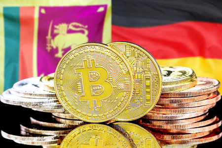Concept for investors in cryptocurrency and Blockchain technology in the Sri Lanka and Germany. Bitcoins on the background of the flag Sri Lanka and Germany.の写真素材
