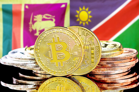 Concept for investors in cryptocurrency and Blockchain technology in the Sri Lanka and Namibia. Bitcoins on the background of the flag Sri Lanka and Namibia.の写真素材