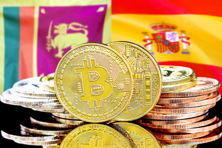 Concept for investors in cryptocurrency and Blockchain technology in the Sri Lanka and Spain. Bitcoins on the background of the flag Sri Lanka and Spain.の写真素材