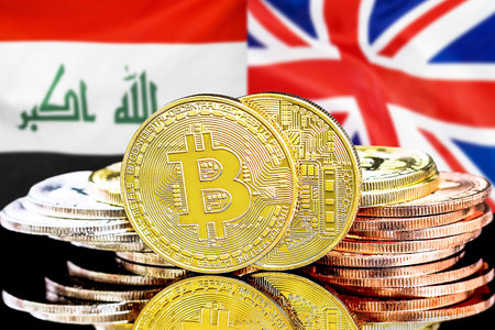 Concept for investors in cryptocurrency and Blockchain technology in the Iraq and United Kingdom. Bitcoins on the background of the flag Iraq and United Kingdom.の写真素材