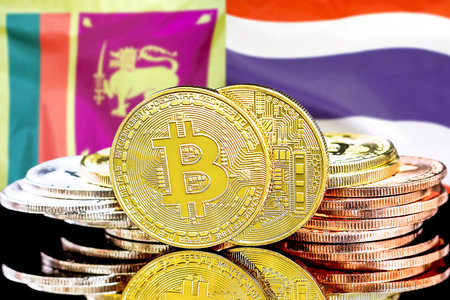 Concept for investors in cryptocurrency and Blockchain technology in the Sri Lanka and Thailand. Bitcoins on the background of the flag Sri Lanka and Thailand.の写真素材