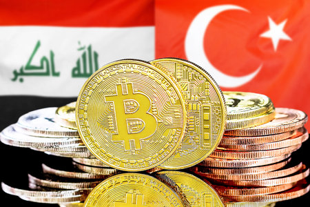 Concept for investors in cryptocurrency and Blockchain technology in the Iraq and Turkey. Bitcoins on the background of the flag Iraq and Turkey.の写真素材
