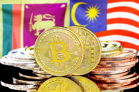 Concept for investors in cryptocurrency and Blockchain technology in the Sri Lanka and Malaysia. Bitcoins on the background of the flag Sri Lanka and Malaysia.の写真素材