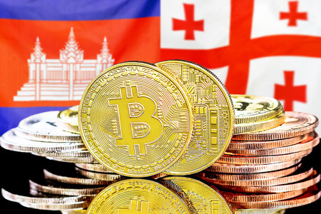 Concept for investors in cryptocurrency and Blockchain technology in the Cambodia and Georgia. Bitcoins on the background of the flag Cambodia and Georgia.の写真素材