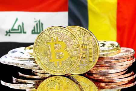 Concept for investors in cryptocurrency and Blockchain technology in the Iraq and Belgium. Bitcoins on the background of the flag Iraq and Belgium.の写真素材