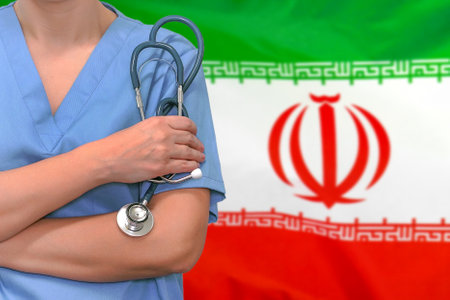 Female surgeon or doctor with stethoscope in hand on the background of the Iran flag. Surgery concept in Iranの写真素材