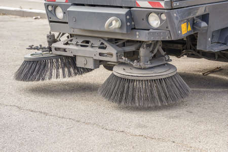 Part of a street cleaning vehicle. Street sweeper machine workingの写真素材