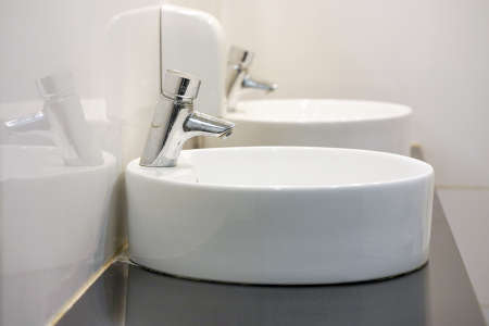 Bathroom interior sink with modern design in luxury hotel. Interior of bathroom with washbasin and...