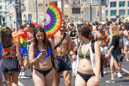 Gay and lesbians walking in the Gay Pride parade. Parade of tolerance. Rainbow flags at Gay pride parade. The annual parade LGBT. 14 June 2019. Tel Aviv. Israelのeditorial素材