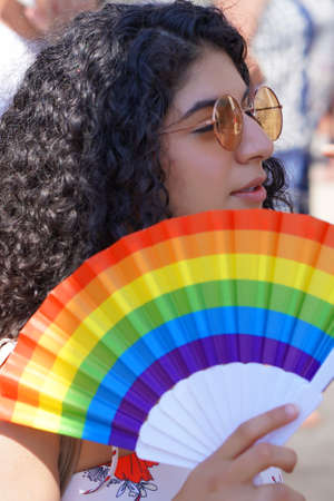 The annual parade LGBT. Portrait of woman in the Gay Pride parade. Parade of tolerance. Rainbow...