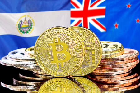 Concept for investors in cryptocurrency and Blockchain technology in El Salvador and New Zealand. Bitcoins on the background of the flag El Salvador and New Zealandの写真素材