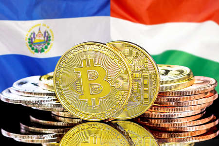 Concept for investors in cryptocurrency and Blockchain technology in El Salvador and Hungary. Bitcoins on the background of the flag El Salvador and Hungaryの写真素材