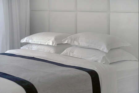 Modern hotel bed in the hotelの写真素材
