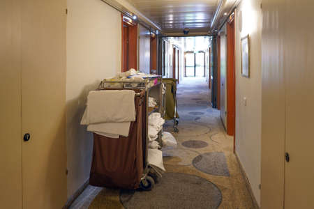 Cleaners trolley with cleaning equipments at hotelの写真素材