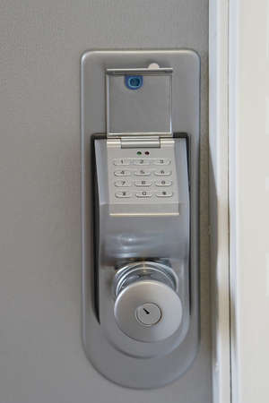Door code in the handle of the entrance door to the apartment close-up. Secure password on keyboard for opening home house door. The security code combination to unlock the doorの写真素材