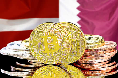 Bitcoins on the background of flag Latvia and Qatar. Concept for investors in cryptocurrency and Blockchain technology in Latvia and Qatarの写真素材
