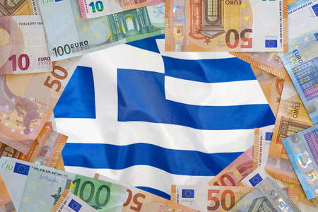 Mockup of Euro banknotes on flag Greece background. Different Euro banknotes frame. Business,...