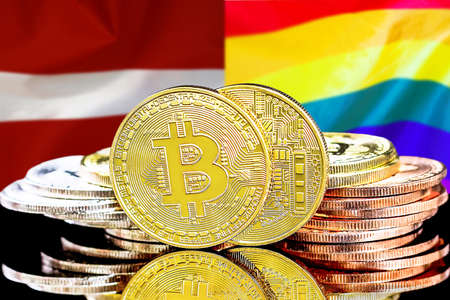 Bitcoins on the background of flag Latvia and Rainbow. Concept for investors in cryptocurrency and Blockchain technology in Latvia and LGBTの写真素材