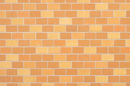 Vintage style in natural light ancient cream beige yellow brown brick wall textured backgroundの写真素材