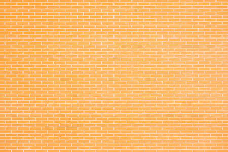 Vintage style in natural light ancient cream beige yellow brown brick wall textured backgroundの写真素材